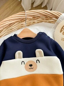 SHEIN Neugeborenen Baby Jungen süßer Farbblock Cartoon Muster Langarm Sweatshirt & Hose mit elastischem Bund Set, Herbst/Winter