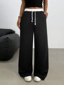 SHEIN Quần nỉ ống rộng dáng suông, cạp thấp, chun co giãn, thích hợp cho nữ tuổi teen, đa năng cho mùa xuân, hè, thu, đông. Phù hợp mặc hàng ngày, phong cách đường phố, ở nhà, ấm cúng mùa thu đông. Quần thoải mái phù hợp cho năm mới, hàng ngày, lễ hội, mùa thu đông, dễ mặc, phối đồ nhiều lớp, thời trang. - Đen và trắng - Xem 7