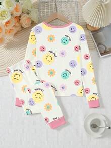 女孩可爱笑脸印花针织弹力面料长袖上衣和裤子两件套睡衣套装，米色带粉色饰边