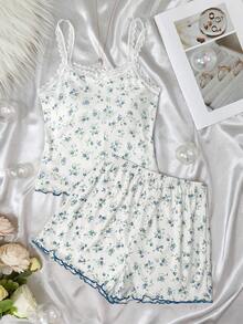 SHEIN Conjunto de pijama cómodo y casual de 2 piezas (camiseta y pantalones cortos) con estampado floral y lazo para niña preadolescente, color rosa