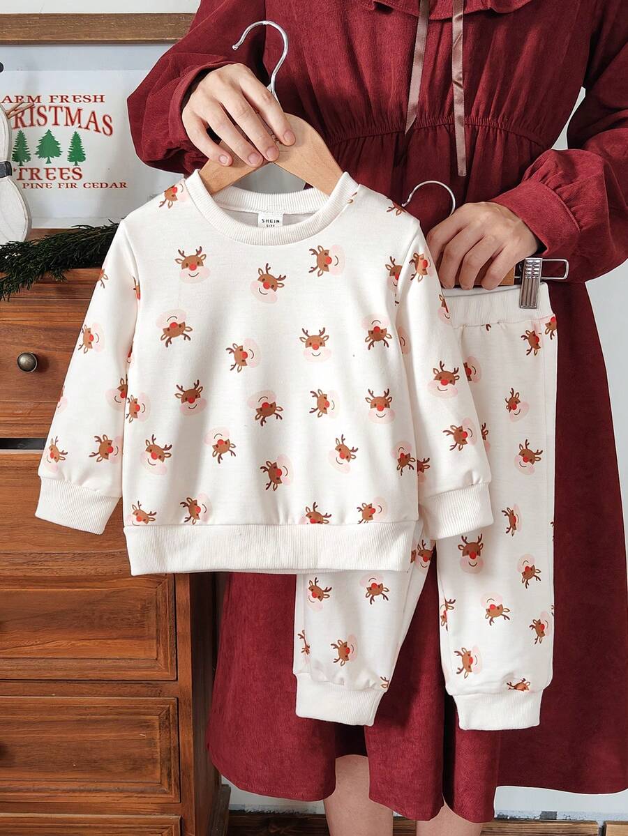 Vintaside Kids 秋冬圣诞宝宝两件套,乳白色驯鹿圆领长袖卫衣搭配锥形长裤,适合居家悠闲享用热饮、游玩圣诞主题乐园、参加跨年派对、家庭聚餐等场景。 - 彩色 - 查看 1