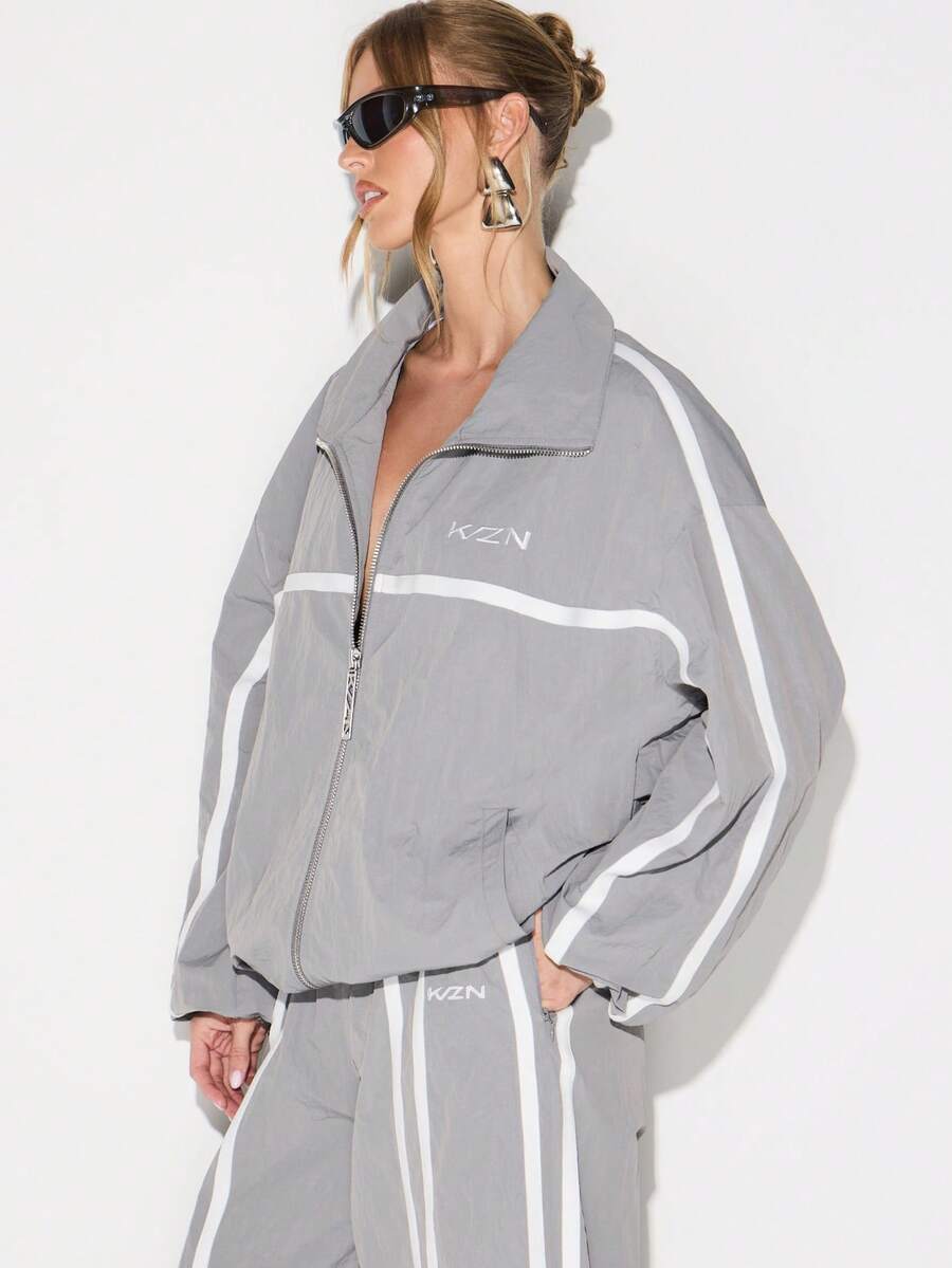 KIZN Lightweight Reflective Windbreaker Jacket With Zip Closure And Side Stripe Detail For Women - Dark Grey - View 1
