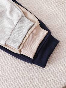 SHEIN Vintaside Kids 3-Pack Newborn Baby Boy/Girl All-Match Solid Color Footie Pants (Black, White, Blue), Versatile For Home, Outdoor Play, Travel & More, Value Pack Baby Boy Joggers Pants Baby Boys Bottoms Baby Trousers