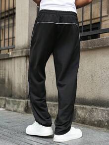 Manfinity Homme Pantaloni de trening casual cu dungi laterale imprimate pentru bărbați, pantaloni de trening negri pentru bărbați, pantaloni de trening cu dungi laterale largi, pantaloni de sală de stradă