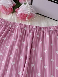 1 Conjunto de pijama para niña, top de manga larga color magenta y pantalones a juego, conjunto de 2 piezas de ropa de dormir, con diseño de rayas verticales con corazón y acento de lazo blanco, tela de punto suave y elástica, apta para ropa de dormir o uso casual, diseño sencillo para combinar fácilmente, ajuste cómodo para adolescentes