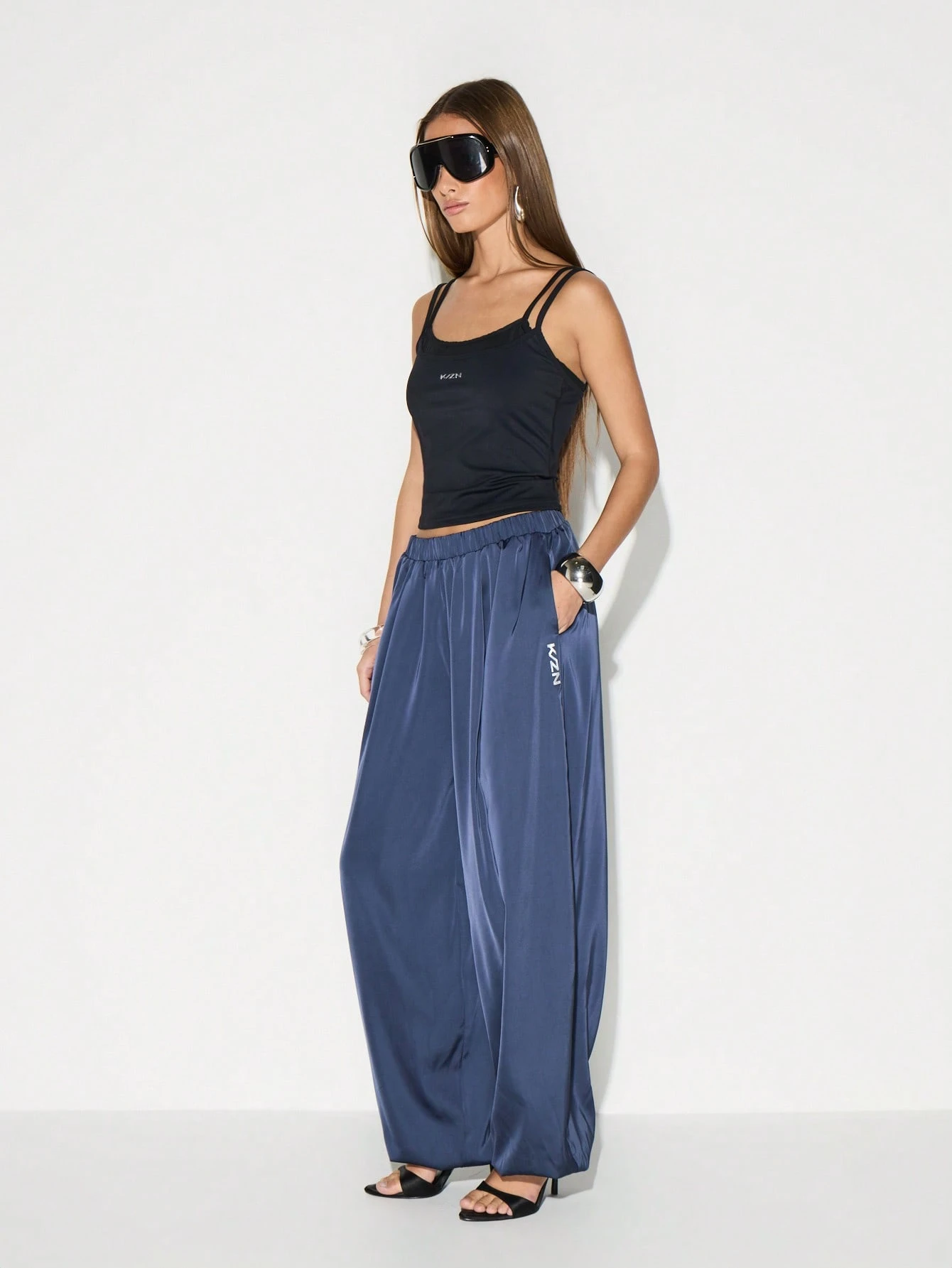 KIZN Pantaloni jogger in raso con tasche