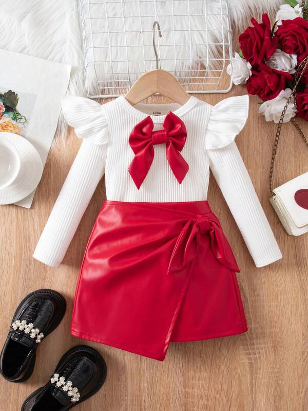 Set de 2 piezas de top de manga larga con lazo y minifalda de cuero sintético PU casual para bebé niña