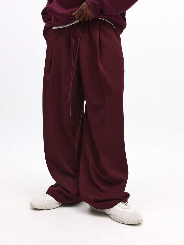 Pantalones holgados con pliegues y cordón