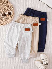 SHEIN Vintaside Kids 3-Pack Newborn Baby Boy/Girl All-Match Solid Color Footie Pants (Black, White, Blue), Versatile For Home, Outdoor Play, Travel & More, Value Pack Baby Boy Joggers Pants Baby Boys Bottoms Baby Trousers