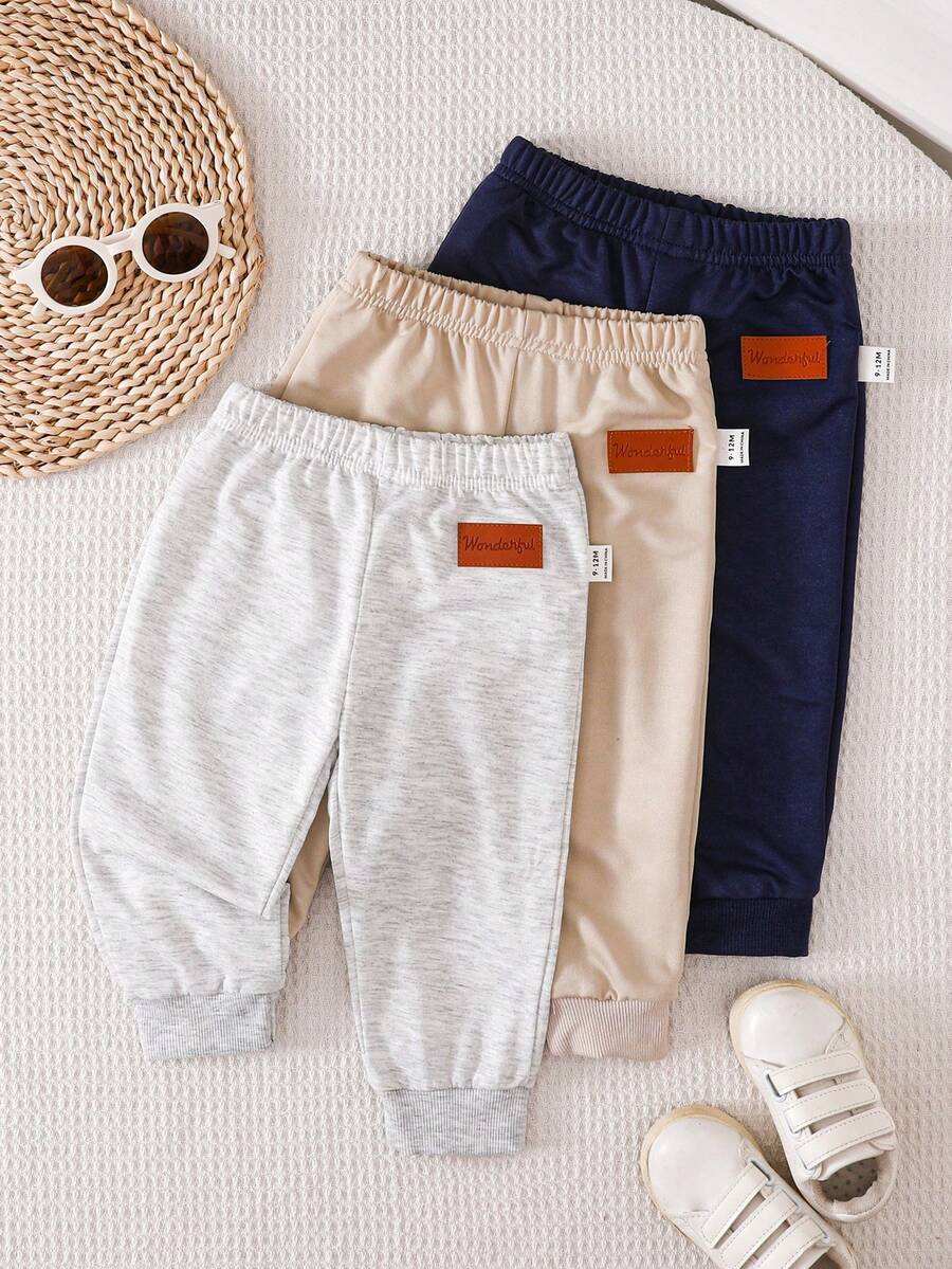 SHEIN Vintaside Kids 3-Pack Newborn Baby Boy/Girl All-Match Solid Color Footie Pants (Black, White, Blue), Versatile For Home, Outdoor Play, Travel & More, Value Pack Baby Boy Joggers Pants Baby Boys Bottoms Baby Trousers