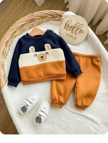 SHEIN Neugeborenen Baby Jungen süßer Farbblock Cartoon Muster Langarm Sweatshirt & Hose mit elastischem Bund Set, Herbst/Winter