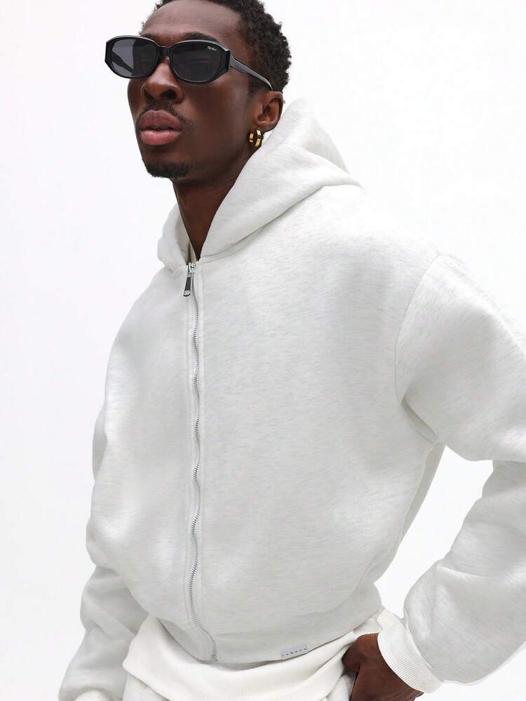 Sweat-shirt à capuche court et zippé