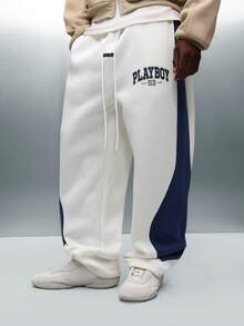 PLAYBOY X SUMWON Pantalones de chándal de pierna ancha y entrepierna caída con panel de rayas laterales y cintura con cordón para comodidad casual - Azul y blanco - Ver 1