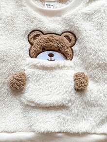 Vintaside Kids Babyboy A Two Pieces Set Of Winter Beige Double-Sided Fleece Round-Neck Long-Sleeved Top And Khaki Tapered Long Pants Comes With A Cute Three-Dimensional Bear Ear Hat. The Pocket On The Chest Has A Cute And Adorable Bear Embroidery Pattern. Made Of Plush Fabric, It Is Warm And Comfortable, Suitable For Daily Outings Such As Going To School, Taking A Vacation, Learning To Walk, Relaxing At Home, And Attending Parties