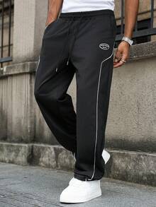 Manfinity Homme Pantaloni de trening casual cu dungi laterale imprimate pentru bărbați, pantaloni de trening negri pentru bărbați, pantaloni de trening cu dungi laterale largi, pantaloni de sală de stradă