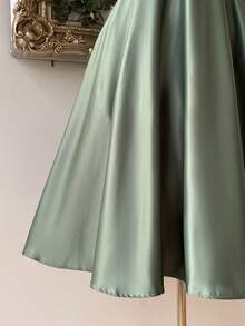 Lovelzi Elegant And Gorgeous Green Satin Fabric Dress For Women. Luxurious Spaghetti Strap Contrast Sequins Pleated Structure. Suspender Fluffy Mid-Dress With Large Hem. Back Strap With Bow. Suitable For Prom Party, Back-To-School Season, Halloween Formal Prom Dress., Semi Formal Dress, For Birthday, Wedding Guest, Graduation, Homecoming