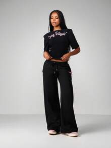 Missguided x Playboy Stay Smocked T-Shirt With Ruffle Hem And Pink Script For Casual Summer Wear - Black - View 4