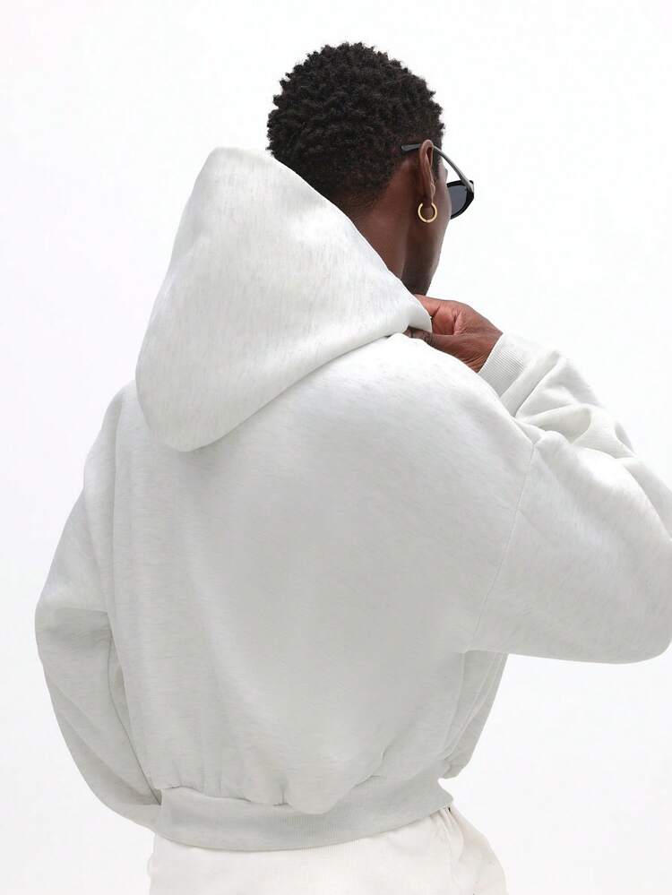 Sweat-shirt à capuche court et zippé