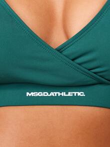 MISSGUIDED Áo ngực thể thao hở vai cổ chữ V sâu có dây đeo chéo sau lưng dành cho luyện tập năng động - Màu xanh lá cây đậm - Xem 7