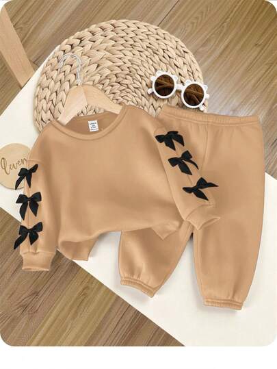 Babygirl 可爱杏色蝴蝶结装饰长袖运动衫和松紧腰裤套装，秋冬