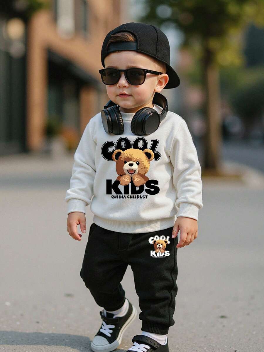 SHEIN 2 pièces/Set Garçon bébé Sweat-shirt-shirt à manches longues col rond confortable avec motif mignon d'ours de bande dessinée, assorti avec un pantalon de survêtement noir. Convient pour l'automne/l'hiver/le printemps, léger et confortable, idéal pour le porter en automne. Tenue décontractée , convient pour les sorties, la photographie de rue, les festivals, les cadeaux. Tenue décontractée pour bébé garçon, vêtements pour bébé garçon, tenue de ville pour bébé garçon, mode bébé Boo