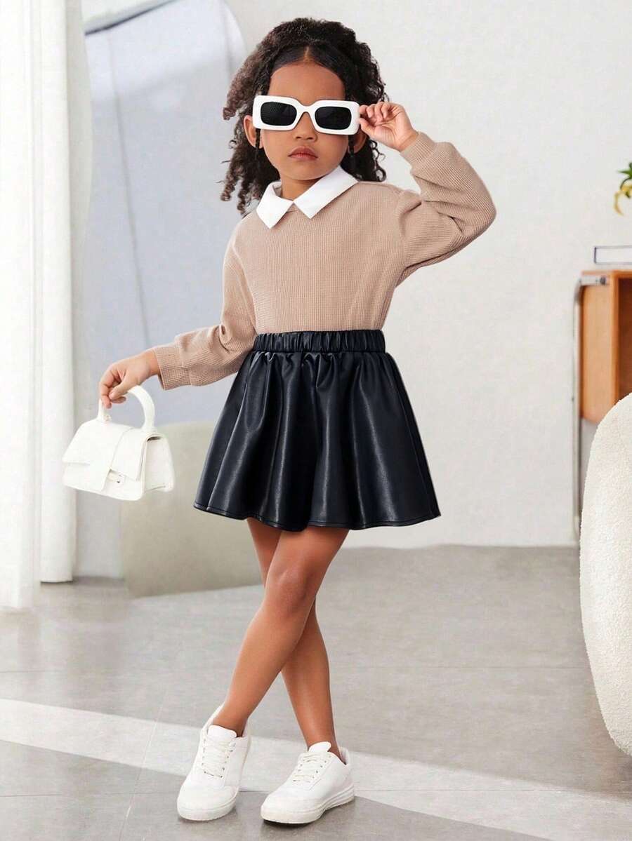 Kleine Mädchen Waffel-Stoff 2-in-1 Top mit Kontrasthem dkragen, kombiniert mit schwarzem PU-Leder Rock, einfach und modisch, geeignet für Ausflüge, minimalistischer Stil