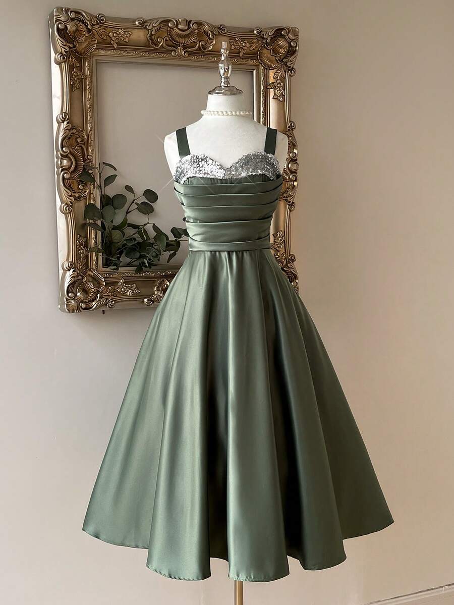 Lovelzi Elegant And Gorgeous Green Satin Fabric Dress For Women. Luxurious Spaghetti Strap Contrast Sequins Pleated Structure. Suspender Fluffy Mid-Dress With Large Hem. Back Strap With Bow. Suitable For Prom Party, Back-To-School Season, Halloween Formal Prom Dress., Semi Formal Dress, For Birthday, Wedding Guest, Graduation, Homecoming