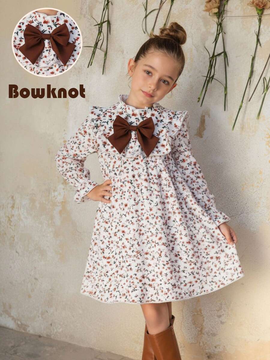 SHEIN Emery Rose Kids Đầm dài tay dáng rộng dễ thương cho bé gái, họa tiết hoa màu mơ, thắt nơ, thích hợp cho kỳ nghỉ hè; Đầm hoa mùa thu, đầm thu màu trắng ngà điểm xuyết đỏ cháy; Đầm xuân thu cho bé gái; Đầm hoa nhún bèo tay dài, chi tiết nơ to và xếp nếp cho bé gái; Đầm hoa tay dài, cổ bèo nhún, thắt nơ to cho bé gái; Đầm chữ A dễ thương, đầm nơ; Đầm in họa tiết hoa mùa thu cho bé gái. - Màu be - Xem 1