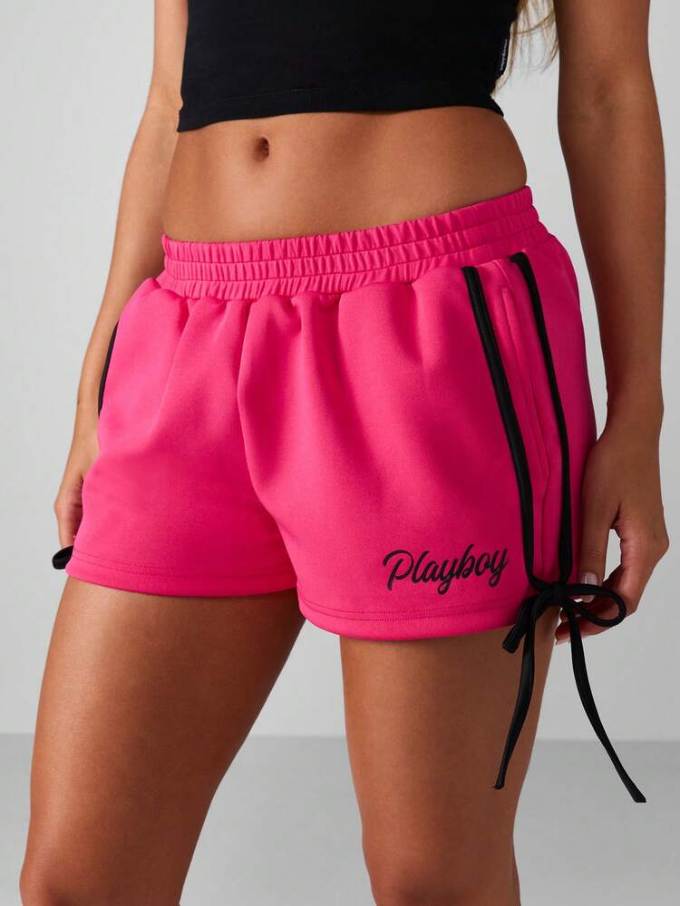 Missguided x Playboy Short de course à liens latéraux avec imprimé logo, taille à cordon de serrage, décontracté pour l'été
