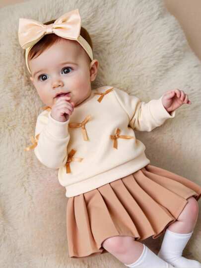 SHEIN 2 件新生儿女婴休闲可爱甜美套装，黄色长袖运动衫搭配桃色蝴蝶结装饰，搭配浅棕色百褶裙，适合日常、上学、摄影、派对