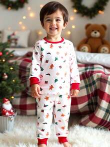 SHEIN Conjunto de pijama de 2 piezas con parte superior con gráfico navideño y pantalón pitillo para niños pequeños, con estampado de renos y copos de nieve, adecuado para Navidad - Rojo y blanco - Ver 6