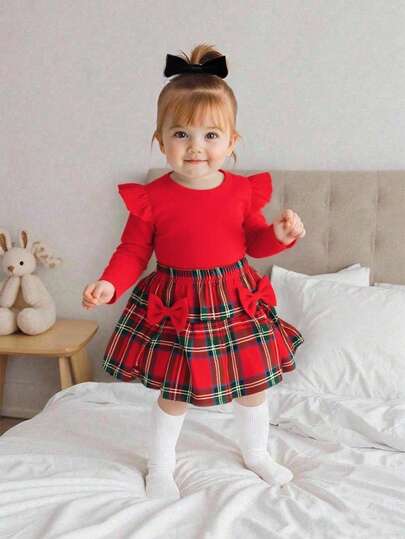 Set de 2 piezas con blusa de manga larga con diseño de volantes en los hombros y falda a cuadros con decoración de moño para niñas bebés, estilo casual y elegante para otoño/invierno