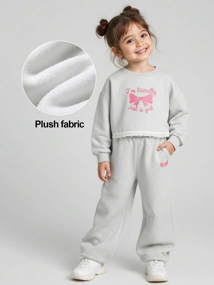 JNSQ Ensemble de 2 pièces pour jeunes filles, Top Sweat-shirt col rond avec nœud imprimé et bordure en dentelle + pantalon de jogging droit ample, convient pour le port quotidien en automne et hiver, les activités extérieures, les vacances, le style de rue, les fêtes et les tenues décontractées