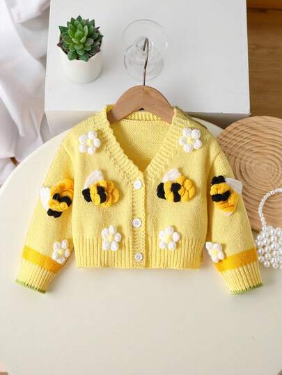 SHEIN Baby Girl Clothing Is , Casual, Fashionable And Cute. It Is Yellow With Flowers And Bee Decorations. It Is A Knitted Long-Sleeved Sweater And Cardigan. It Is Soft And Comfortable, Suitable For Daily Occasions, Outdoor Occasions, Travel Scenes, Vacation Scenes, Home Scenes, And Nursery Scenes. It Is Suitable For Autumn And Winter, Christmas, Back-To-School Outfits, And Baby Girls Clothes