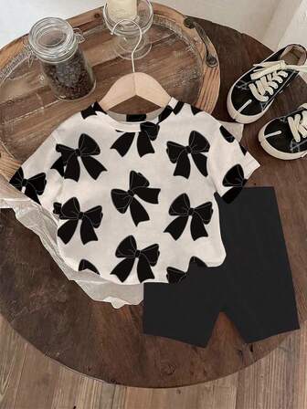 SHEIN Baby Girls' Bow Allover Print Round Neck Short Sleeve T-Shirt And Knitted Legging Shorts 2 Pieces Outfit, Adorable, Black Bow Baby Outfit Casual Baby Girl Clothes