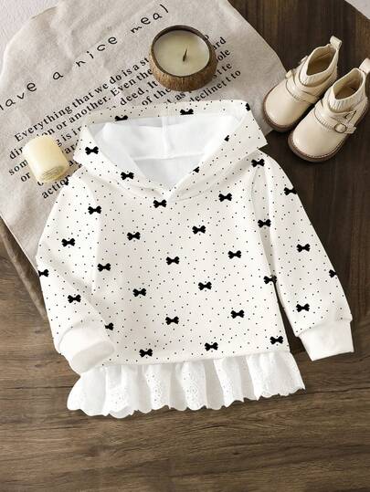 女婴休闲可爱秋冬儿童时尚刺绣荷叶边印花连帽卫衣，通体波点蝴蝶结图案，舒适长袖卫衣，适合秋冬春季穿着，轻盈保暖，时尚休闲，适合返校、户外活动、摄影、校园、度假等场合，也是一份贴心的礼物。
