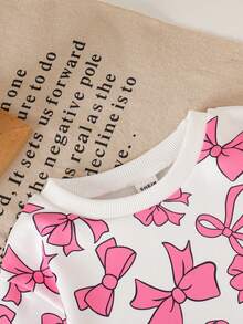 SHEIN Bộ đồ 2 món cho bé gái, gồm áo nỉ in nơ màu hồng, kiểu dáng rộng rãi thoải mái và quần dài, thời trang và đa năng. - Hồng - Xem 3