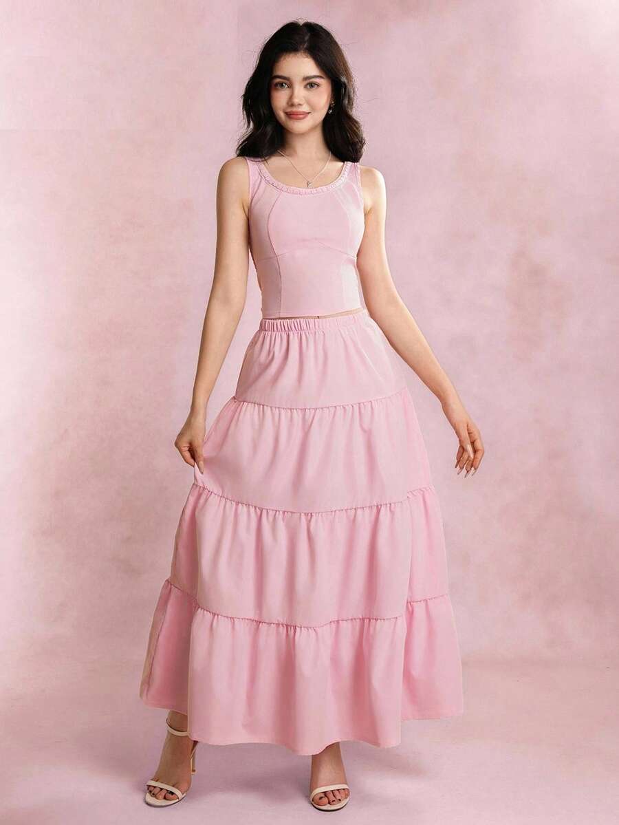 青少年（女孩）两件套服装，春夏休闲优雅，包括粉色无袖蝴蝶结吊带衫和粉色长裙