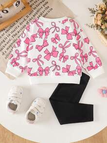 SHEIN Bộ đồ 2 món cho bé gái, gồm áo nỉ in nơ màu hồng, kiểu dáng rộng rãi thoải mái và quần dài, thời trang và đa năng. - Hồng - Xem 2