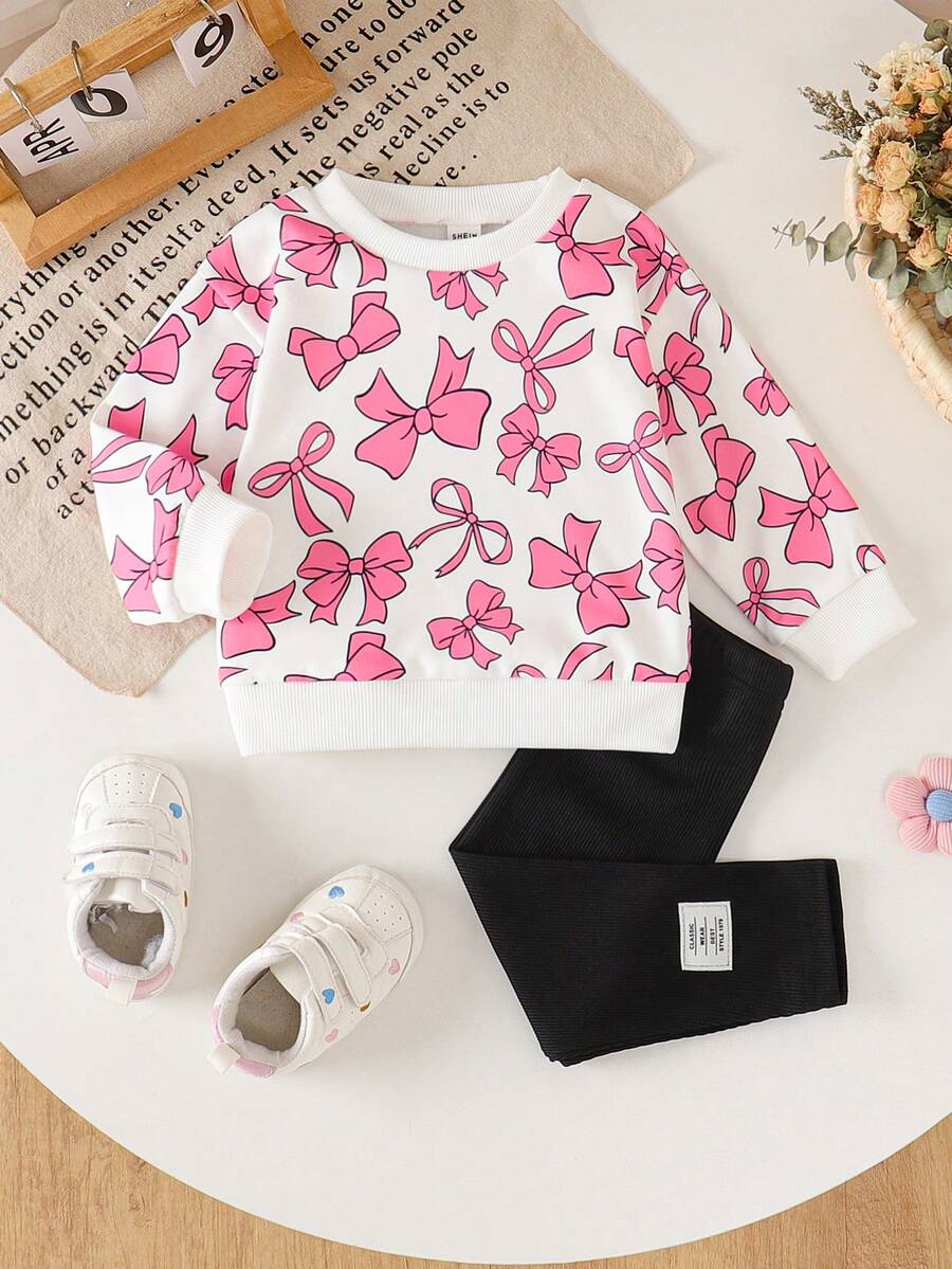 SHEIN Bộ đồ 2 món cho bé gái, gồm áo nỉ in nơ màu hồng, kiểu dáng rộng rãi thoải mái và quần dài, thời trang và đa năng. - Hồng - Xem 1