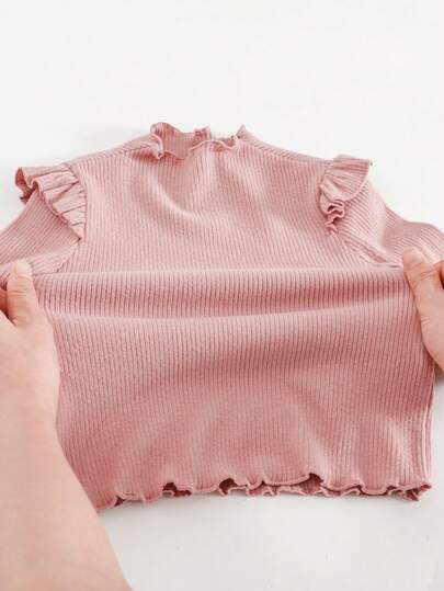 Cozy Pixies Blusa de manga larga con cuello redondo y volantes en el bajo, de unicolor, versátil y cómoda para bebé niña