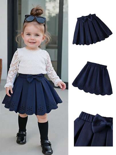 女童海军蓝褶饰蝴蝶结喇叭下摆可爱休闲裙，优雅日常穿着
