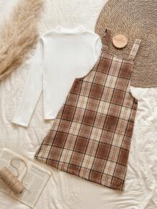 Vintaside Kids Completo da ragazza pre-adolescente composto da una maglietta a maniche lunghe con collo alto beige a righe e un vestito a canottiera in tweed a quadri per l'autunno e l'inverno. Le spalline del vestito a canottiera possono essere regolate in lunghezza e ci sono bottoni in vita per facilitare l'indossare e il togliere. Lo stile è retrò, semplice e da scuola. Il motivo a quadri è alla moda e versatile, rendendolo perfetto per un pomeriggio rilassante a casa, un'uscita e un picnic autunnale, la partecipazione a feste e eventi scolastici. - Cachi - Visualizzare 2
