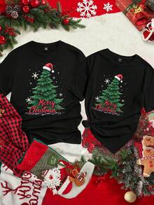 Manfinity Homme Camiseta de manga corta negra casual para hombres con estampado de copos de nieve navideños, árbol de Navidad y lema "Feliz Navidad"