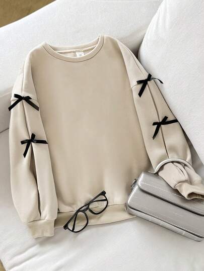 SHEIN 少女宽松休闲简约舒适圆领长袖卫衣，带蝴蝶结装饰，秋冬女童服装