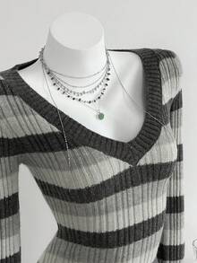 Elamini Suéter de punto ajustado con cuello en V, mangas largas y hombros regulares, a rayas, sexy y de moda para mujer