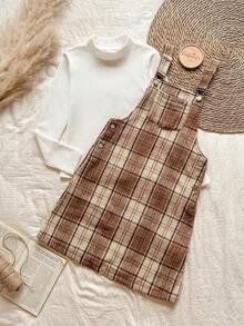 Vintaside Kids Completo da ragazza pre-adolescente composto da una maglietta a maniche lunghe con collo alto beige a righe e un vestito a canottiera in tweed a quadri per l'autunno e l'inverno. Le spalline del vestito a canottiera possono essere regolate in lunghezza e ci sono bottoni in vita per facilitare l'indossare e il togliere. Lo stile è retrò, semplice e da scuola. Il motivo a quadri è alla moda e versatile, rendendolo perfetto per un pomeriggio rilassante a casa, un'uscita e un picnic autunnale, la partecipazione a feste e eventi scolastici. - Cachi - Visualizzare 3
