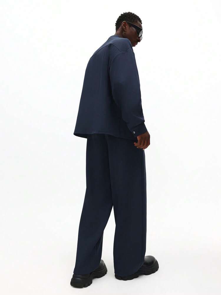 Completo camicia con bottoni e pantaloni a gamba larga