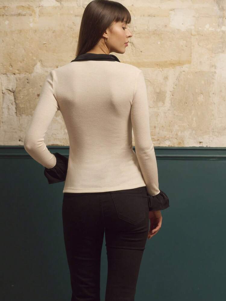 Beige Knit Shirt With Black Contrast Ruffles And Long Sleeves With Flared Cuffs Vintage Chic Autumn Winter.