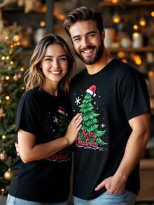 Manfinity Homme Camiseta de manga corta negra casual para hombres con estampado de copos de nieve navideños, árbol de Navidad y lema "Feliz Navidad"